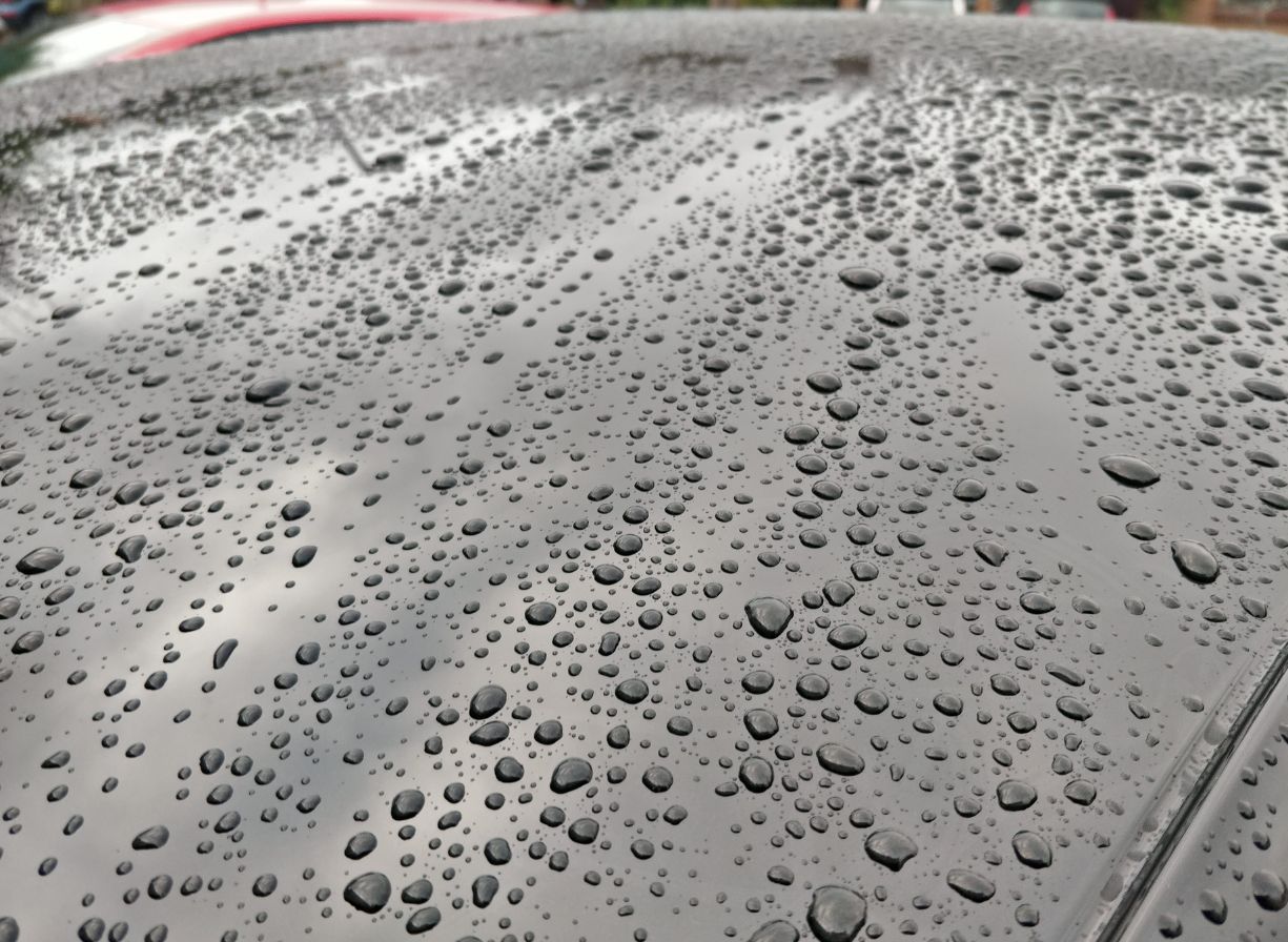 water beading on a car
