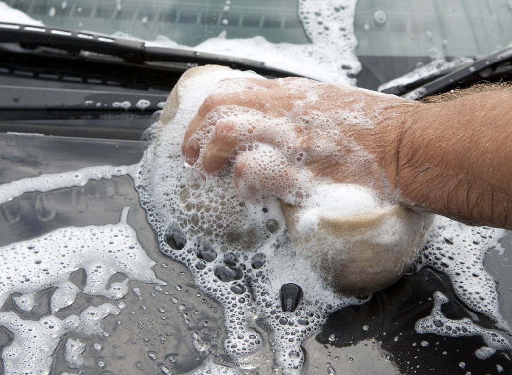 washing car window with sponge